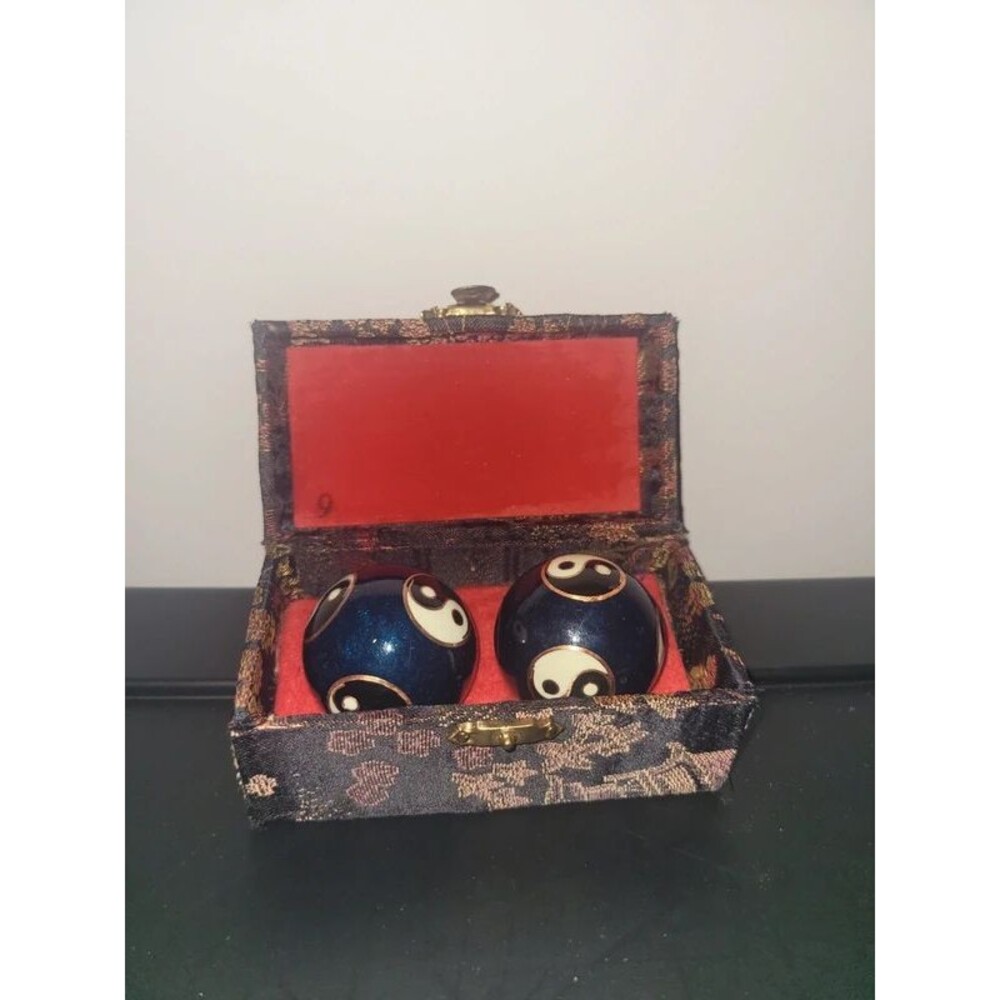 blue Chinese Baoding balls decorated with Yin-Yang symbol)